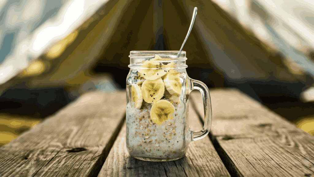 Mason jar of overnight oats with banana slices and chia seeds