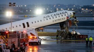 Air Canada Express CRJ-900 on Runway 4 at LaGuardia Airport at night with emergency response vehicles, representing the March 2026 runway collision.